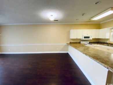 Welcome to this charming first-floor condo located in the heart on Myrtlewood Golf Course and Club  in South Carolina - for sale on GolfHomes.com, golf home, golf lot
