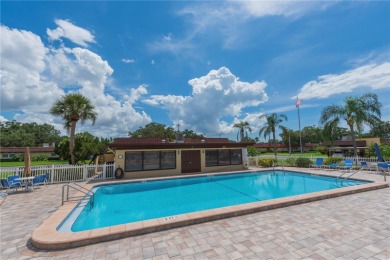 Ready to swap high-maintenance for high-enjoyment? This on The Dunedin Country Club in Florida - for sale on GolfHomes.com, golf home, golf lot
