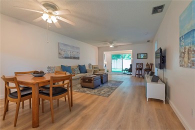 Ready to swap high-maintenance for high-enjoyment? This on The Dunedin Country Club in Florida - for sale on GolfHomes.com, golf home, golf lot