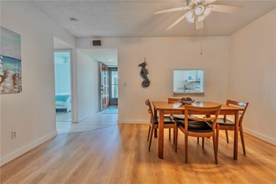 Ready to swap high-maintenance for high-enjoyment? This on The Dunedin Country Club in Florida - for sale on GolfHomes.com, golf home, golf lot