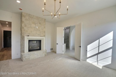 Welcome to your dream oasis nestled within the prestigious Teton on Teton Springs Resort and Club in Idaho - for sale on GolfHomes.com, golf home, golf lot