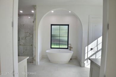 Welcome to your dream oasis nestled within the prestigious Teton on Teton Springs Resort and Club in Idaho - for sale on GolfHomes.com, golf home, golf lot