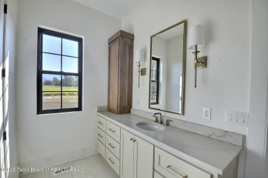 Welcome to your dream oasis nestled within the prestigious Teton on Teton Springs Resort and Club in Idaho - for sale on GolfHomes.com, golf home, golf lot