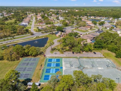 Welcome to your dream home in the sought-after GlenLakes Golf on Glen Lakes Country Club in Florida - for sale on GolfHomes.com, golf home, golf lot