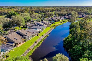 Enjoy serene lake views from this beautiful villa in the on Wyndemere Country Club in Florida - for sale on GolfHomes.com, golf home, golf lot