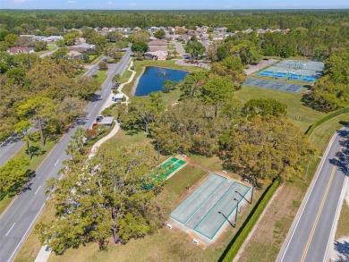 Welcome to your dream home in the sought-after GlenLakes Golf on Glen Lakes Country Club in Florida - for sale on GolfHomes.com, golf home, golf lot