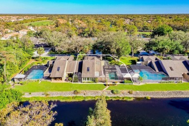 Enjoy serene lake views from this beautiful villa in the on Wyndemere Country Club in Florida - for sale on GolfHomes.com, golf home, golf lot