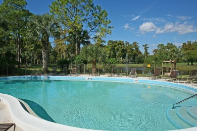 Enjoy serene lake views from this beautiful villa in the on Wyndemere Country Club in Florida - for sale on GolfHomes.com, golf home, golf lot