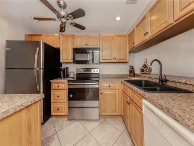 This first floor condo sits steps away from the community pool on Plantation Golf and Country Club in Florida - for sale on GolfHomes.com, golf home, golf lot
