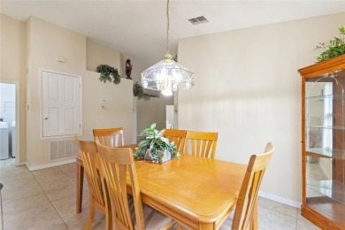 Very nice pool home that is waterfront located in in Ridgewood on Ridgewood Lakes Golf and Country Club in Florida - for sale on GolfHomes.com, golf home, golf lot