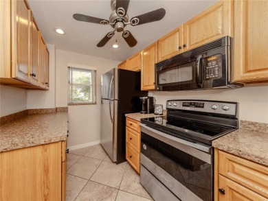 This first floor condo sits steps away from the community pool on Plantation Golf and Country Club in Florida - for sale on GolfHomes.com, golf home, golf lot