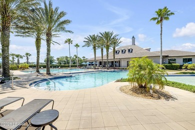 Experience modern Florida living in this stunning two-story home on Plantation Bay Golf and Country Club in Florida - for sale on GolfHomes.com, golf home, golf lot