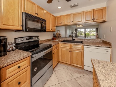 This first floor condo sits steps away from the community pool on Plantation Golf and Country Club in Florida - for sale on GolfHomes.com, golf home, golf lot