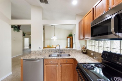 Very nice pool home that is waterfront located in in Ridgewood on Ridgewood Lakes Golf and Country Club in Florida - for sale on GolfHomes.com, golf home, golf lot
