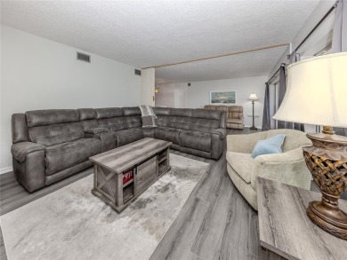 This first floor condo sits steps away from the community pool on Plantation Golf and Country Club in Florida - for sale on GolfHomes.com, golf home, golf lot