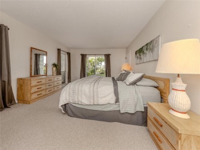 This first floor condo sits steps away from the community pool on Plantation Golf and Country Club in Florida - for sale on GolfHomes.com, golf home, golf lot