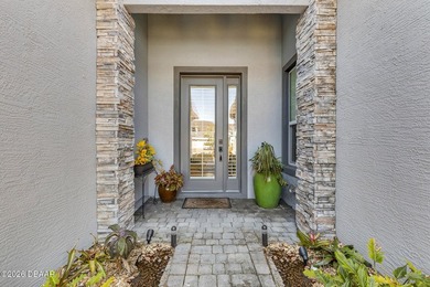 Experience modern Florida living in this stunning two-story home on Plantation Bay Golf and Country Club in Florida - for sale on GolfHomes.com, golf home, golf lot