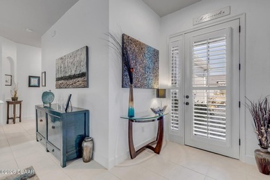 Experience modern Florida living in this stunning two-story home on Plantation Bay Golf and Country Club in Florida - for sale on GolfHomes.com, golf home, golf lot