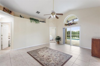 Very nice pool home that is waterfront located in in Ridgewood on Ridgewood Lakes Golf and Country Club in Florida - for sale on GolfHomes.com, golf home, golf lot