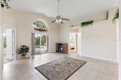 Very nice pool home that is waterfront located in in Ridgewood on Ridgewood Lakes Golf and Country Club in Florida - for sale on GolfHomes.com, golf home, golf lot