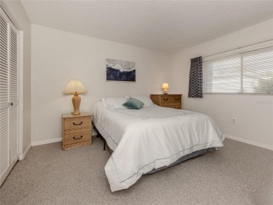 This first floor condo sits steps away from the community pool on Plantation Golf and Country Club in Florida - for sale on GolfHomes.com, golf home, golf lot