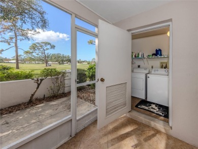 This first floor condo sits steps away from the community pool on Plantation Golf and Country Club in Florida - for sale on GolfHomes.com, golf home, golf lot
