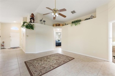 Very nice pool home that is waterfront located in in Ridgewood on Ridgewood Lakes Golf and Country Club in Florida - for sale on GolfHomes.com, golf home, golf lot