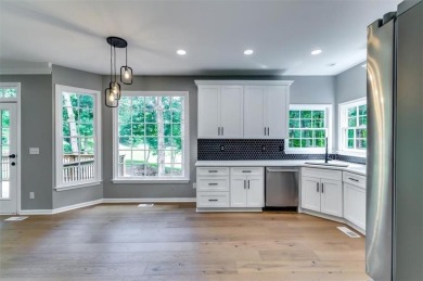 Embrace luxury living at its finest in this fully renovated on Canongate At Olde Atlanta Golf Club in Georgia - for sale on GolfHomes.com, golf home, golf lot