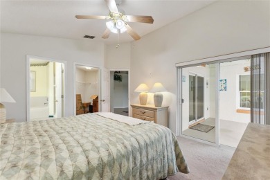 Very nice pool home that is waterfront located in in Ridgewood on Ridgewood Lakes Golf and Country Club in Florida - for sale on GolfHomes.com, golf home, golf lot