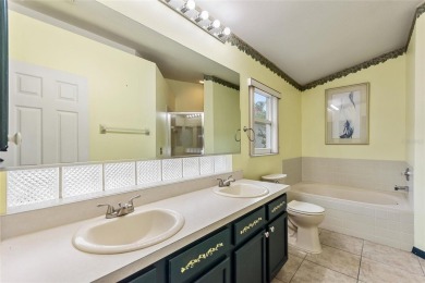 Very nice pool home that is waterfront located in in Ridgewood on Ridgewood Lakes Golf and Country Club in Florida - for sale on GolfHomes.com, golf home, golf lot
