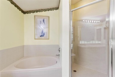 Very nice pool home that is waterfront located in in Ridgewood on Ridgewood Lakes Golf and Country Club in Florida - for sale on GolfHomes.com, golf home, golf lot