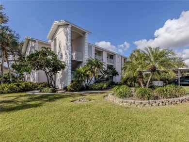 This first floor condo sits steps away from the community pool on Plantation Golf and Country Club in Florida - for sale on GolfHomes.com, golf home, golf lot