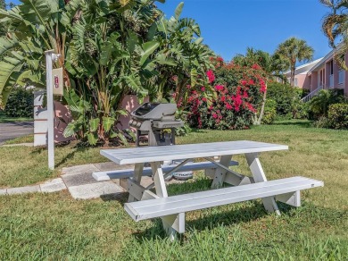 This first floor condo sits steps away from the community pool on Plantation Golf and Country Club in Florida - for sale on GolfHomes.com, golf home, golf lot