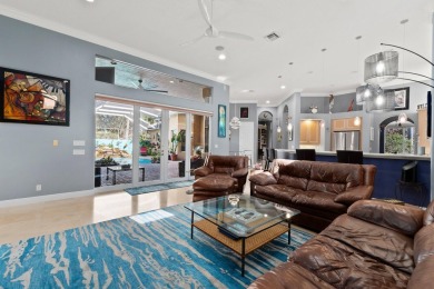 Welcome to this exquisite custom-built courtyard home, perfectly on The Cape Club of Palm City in Florida - for sale on GolfHomes.com, golf home, golf lot