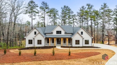 Relax and gaze upon the peaceful water view of this interior on Harbor Club Golf and Country Club in Georgia - for sale on GolfHomes.com, golf home, golf lot