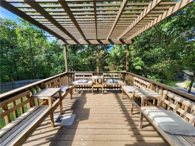 Welcome to this inviting Bella Vista corner-lot home designed on Bella Vista - Metfield Golf Complex and Country Club in Arkansas - for sale on GolfHomes.com, golf home, golf lot