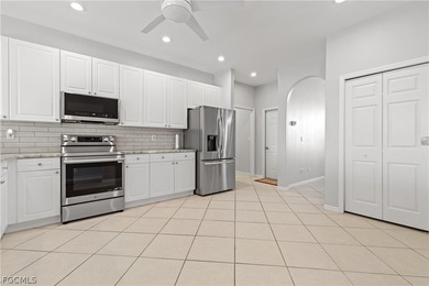 SILVERLAKES SHOWSTOPPER WITH BRAND NEW TILE ROOF & WATERFRONT on Gateway Golf and Country Club in Florida - for sale on GolfHomes.com, golf home, golf lot