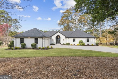 Must see this beautiful updated ranch home nestled in the on Reynolds Lake Oconee - The Landing in Georgia - for sale on GolfHomes.com, golf home, golf lot