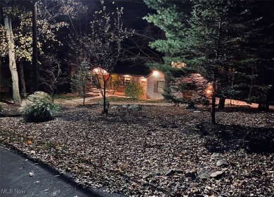 Tucked away in the trees on two beautifully wooded lots at Lake on Lake Mohawk Golf Club in Ohio - for sale on GolfHomes.com, golf home, golf lot