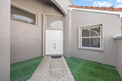 Welcome to this charming 3-bedroom, 3-bathroom home in the on Wycliffe Golf and Country Club in Florida - for sale on GolfHomes.com, golf home, golf lot