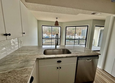 Come home and relax overlooking the water and boats in the cove on Club At Rawls Creek in South Carolina - for sale on GolfHomes.com, golf home, golf lot