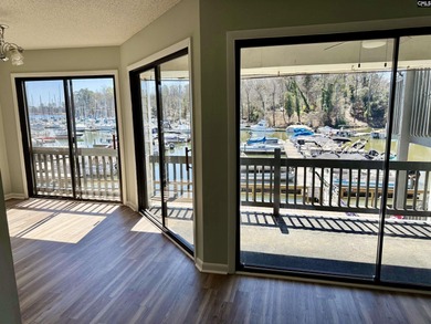 Come home and relax overlooking the water and boats in the cove on Club At Rawls Creek in South Carolina - for sale on GolfHomes.com, golf home, golf lot