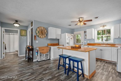Welcome to 132 NE 3rd St, Oak Island, where laid-back beach on Founders Club At St. James Plantation in North Carolina - for sale on GolfHomes.com, golf home, golf lot