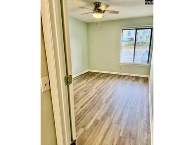 Come home and relax overlooking the water and boats in the cove on Club At Rawls Creek in South Carolina - for sale on GolfHomes.com, golf home, golf lot