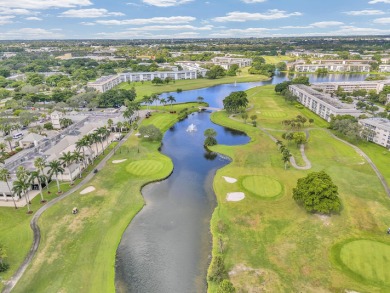Enjoy the best of 55+ living in this lovely 2-bedroom, 2-bath on Wynmoor Golf Course in Florida - for sale on GolfHomes.com, golf home, golf lot