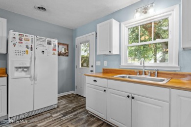 Welcome to 132 NE 3rd St, Oak Island, where laid-back beach on Founders Club At St. James Plantation in North Carolina - for sale on GolfHomes.com, golf home, golf lot