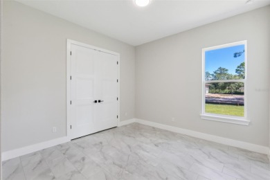 Where Luxury Meets Comfort -- Your Dream Home Awaits on a Full on Wedgefield Golf Club in Florida - for sale on GolfHomes.com, golf home, golf lot
