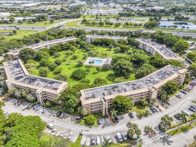 Enjoy the best of 55+ living in this lovely 2-bedroom, 2-bath on Wynmoor Golf Course in Florida - for sale on GolfHomes.com, golf home, golf lot