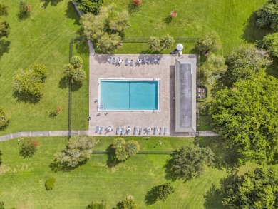 Enjoy the best of 55+ living in this lovely 2-bedroom, 2-bath on Wynmoor Golf Course in Florida - for sale on GolfHomes.com, golf home, golf lot