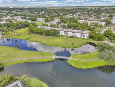Enjoy the best of 55+ living in this lovely 2-bedroom, 2-bath on Wynmoor Golf Course in Florida - for sale on GolfHomes.com, golf home, golf lot